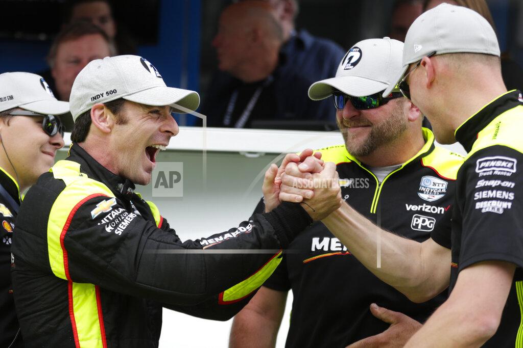 Michael Conroy Simon Pagenaud, of France, celebrates with his crew after winning the pole during qualifications for the Indianapolis 500 IndyCar auto race at Indianapolis Motor Speedway, Sunday, May 19, 2019 in Indianapolis. (AP Photo/Michael Conroy)