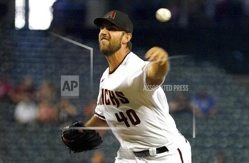 Arizona Diamondbacks' Madison Bumgarner delivers against the Atlanta Braves during the first inning of a baseball game Thursday, Sept 23, 2021, in Phoenix. (AP Photo/Darryl Webb)