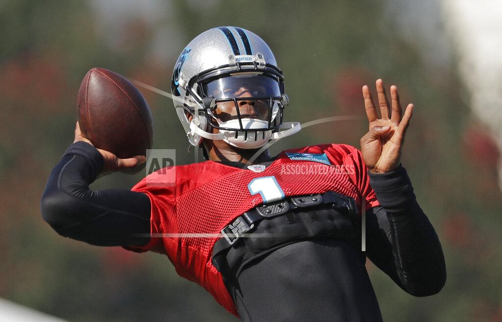 Chuck Burton Carolina Panthers' Cam Newton (1) looks to pass during practice at the NFL football team's training camp in Spartanburg, S.C., Monday, July 29, 2019. (AP Photo/Chuck Burton)