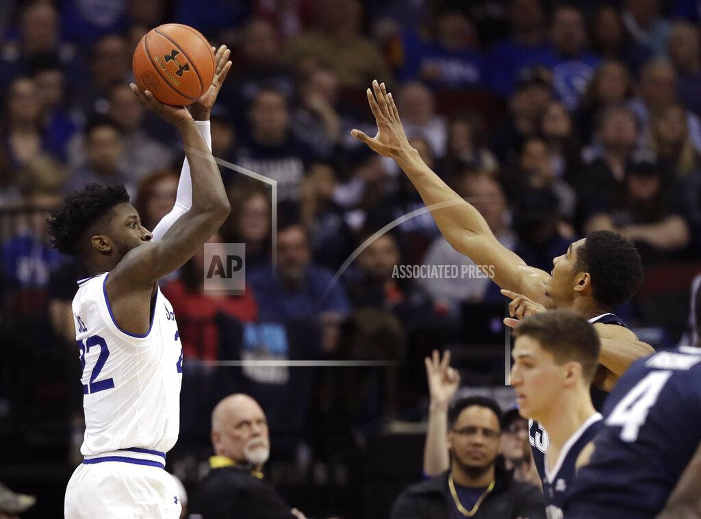 Kathy Willens Seton Hall guard Myles Cale (22) shoots a 3-point shot with Villanova forward Jermaine Samuels, right, defending, during the first half an NCAA basketball game, Saturday, March 9, 2019, in Newark, N.J. Cale had 19 points as Seton Hall defeated Villanova 79-75. (AP Photo/Kathy Willens)