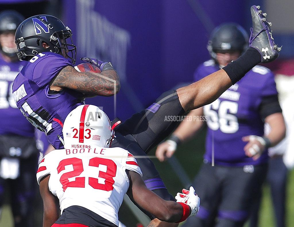 Jim Young Northwestern's Ramaud Chiaokhiao-Bowman, top, makes a catch next to Nebraska's Dicaprio Bootle during the second half of an NCAA college football game Saturday, Oct. 13, 2018, in Evanston, Ill.. (AP Photo/Jim Young)