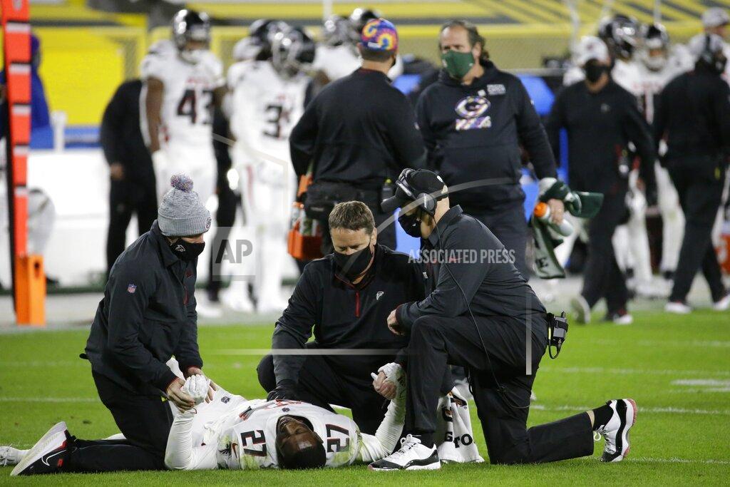 Mike Roemer FILE - In this Oct. 5, 2020, file photo, Atlanta Falcons' Damontae Kazee (27) is tended to during the first half of an NFL football game against the Green Bay Packers, in Green Bay, Wis. The Falcons are looking to have some injured players return to their depleted defense for Sunday's game against Carolina. The winless Falcons have lost five members of their secondary.(AP Photo/Mike Roemer, File)