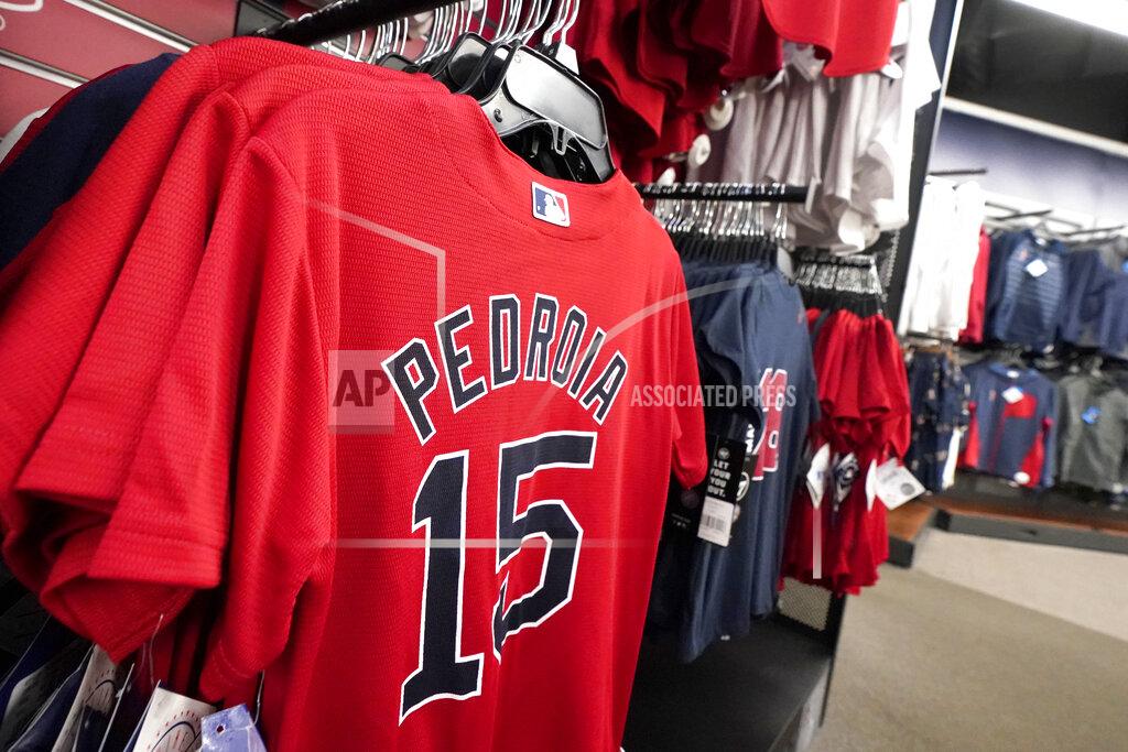 Elise Amendola Dustin Pedroia baseball jerseys are displayed at a Fenway Park pro shop, Monday Feb. 1, 2021, in Boston. Pedroia, who was the 2007 Rookie of the Year and the AL MVP in his second season, retired Monday. (AP Photo/Elise Amendola)