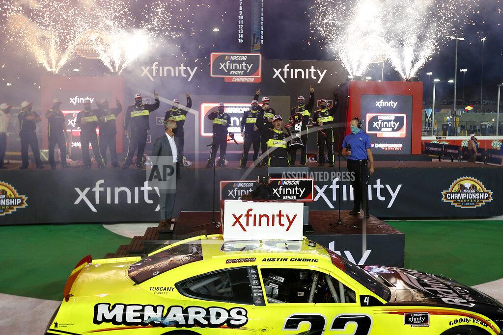 Ralph Freso Austin Cindric, center, celebrates in victory lane after winning the season championship and the NASCAR Xfinity Series auto race at Phoenix Raceway, Saturday, Nov. 7, 2020, in Avondale, Ariz. (AP Photo/Ralph Freso)