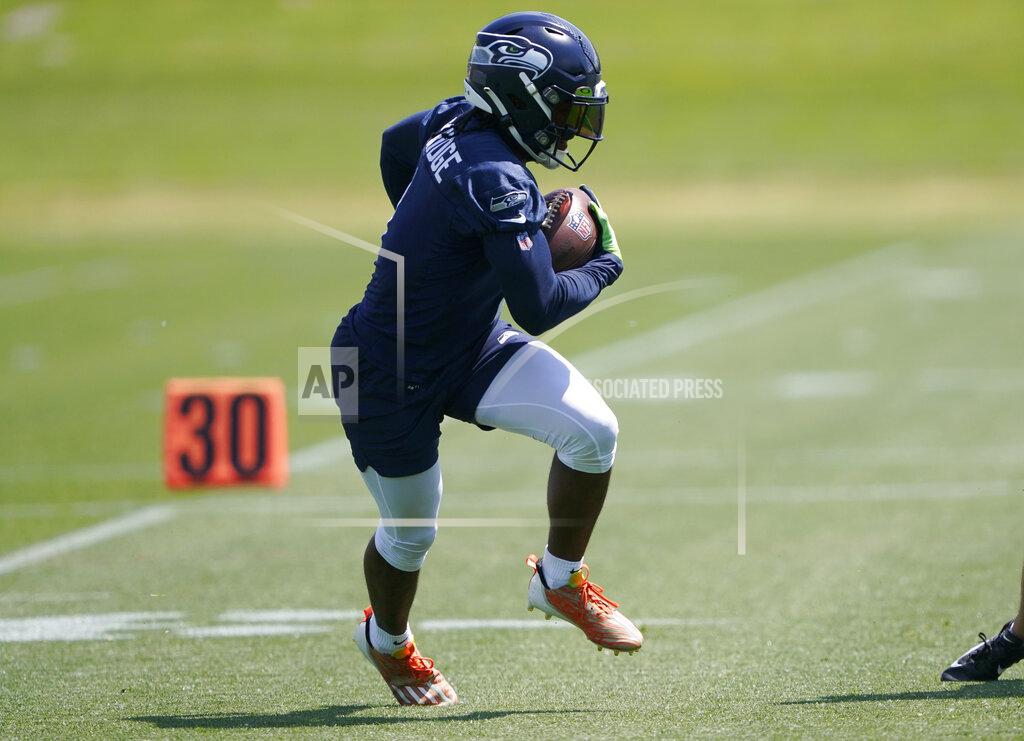 Ted S. Warren Seattle Seahawks wide receiver Dee Eskridge runs a drill during NFL football practice Monday, May 23, 2022, in Renton, Wash. (AP Photo/Ted S. Warren)