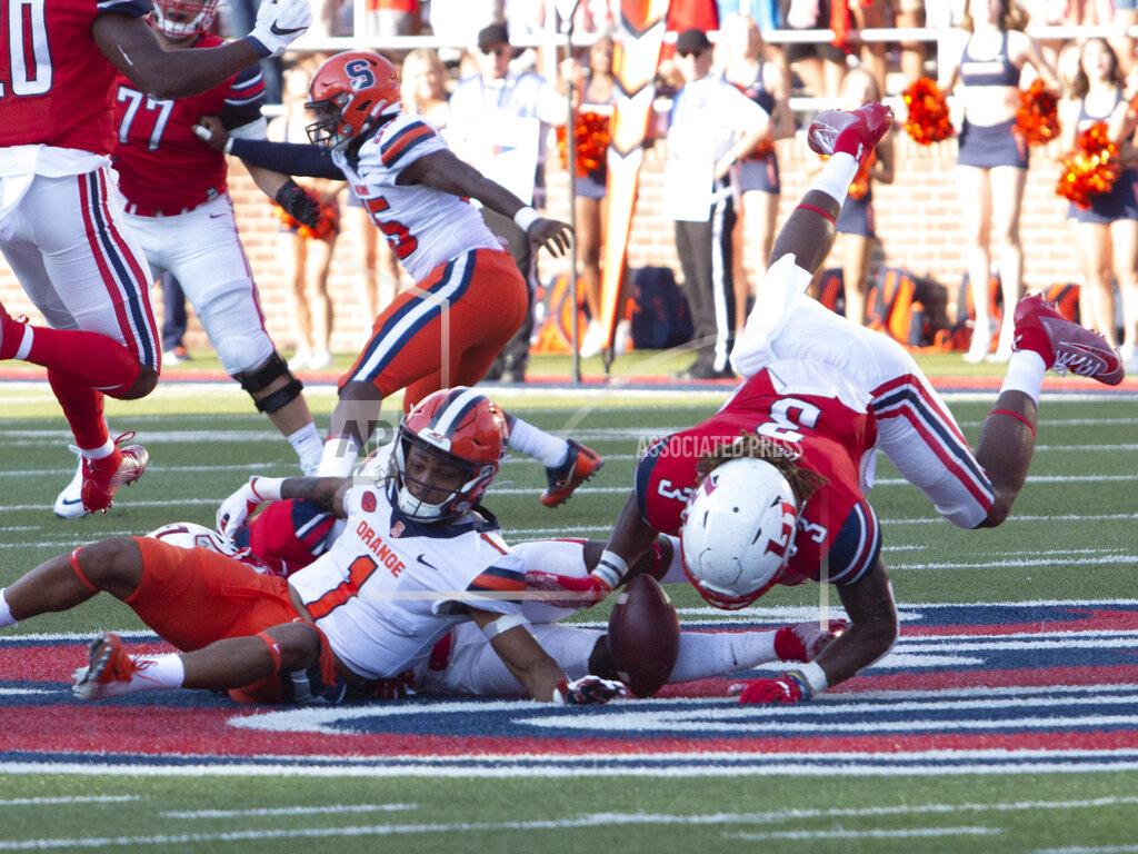 Matt Bell Liberty safety Rion Davis picks up the ball fumbled by Syracuse wide receiver Sean Riley during the first half of an NCAA college football game in Lynchburg, Va. Saturday, Aug. 31, 2019. (AP Photo/Matt Bell)
