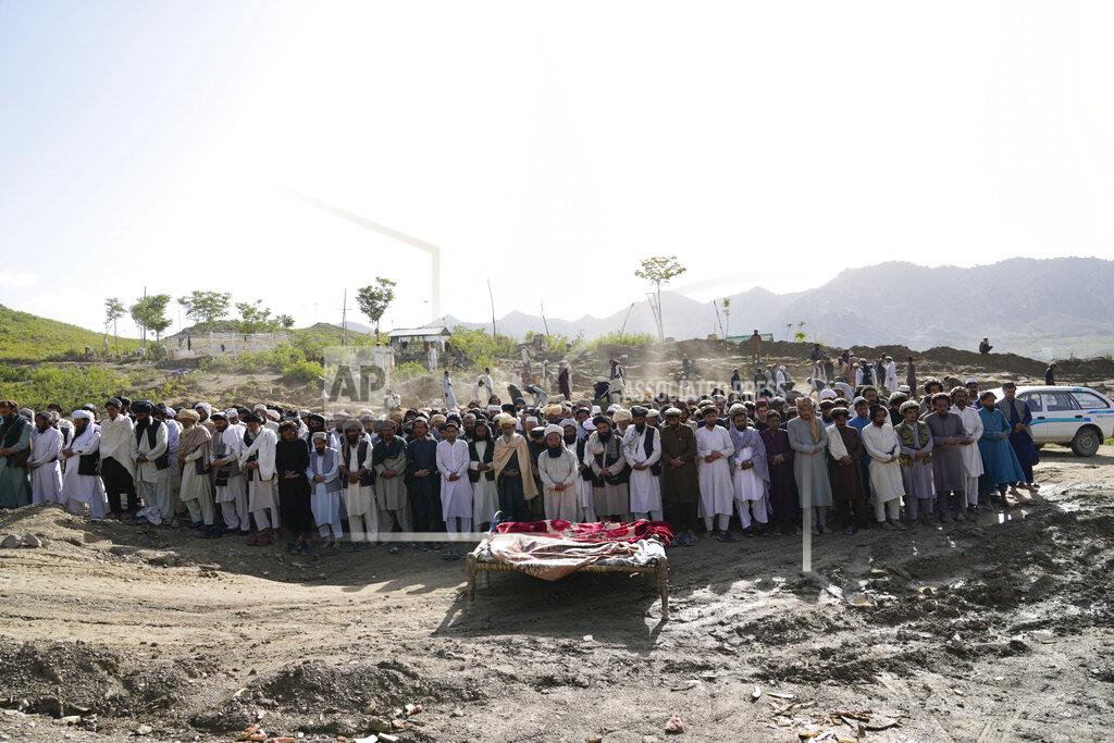 Ebrahim Noroozi Afghans pray for relatives killed in an earthquake to a burial site l in Gayan village, in Paktika province, Afghanistan, Thursday, June 23, 2022. A powerful earthquake struck a rugged, mountainous region of eastern Afghanistan early Wednesday, flattening stone and mud-brick homes in the country's deadliest quake in two decades, the state-run news agency reported. (AP Photo/Ebrahim Nooroozi)