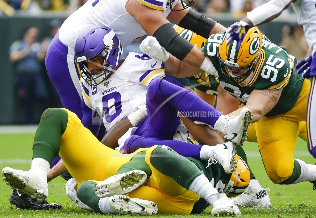 Mike Roemer Minnesota Vikings' Kirk Cousins fumbles as he is hit during the first half of an NFL football game against the Green Bay Packers Sunday, Sept. 15, 2019, in Green Bay, Wis. The Packers recovered the fumble.(AP Photo/Mike Roemer)