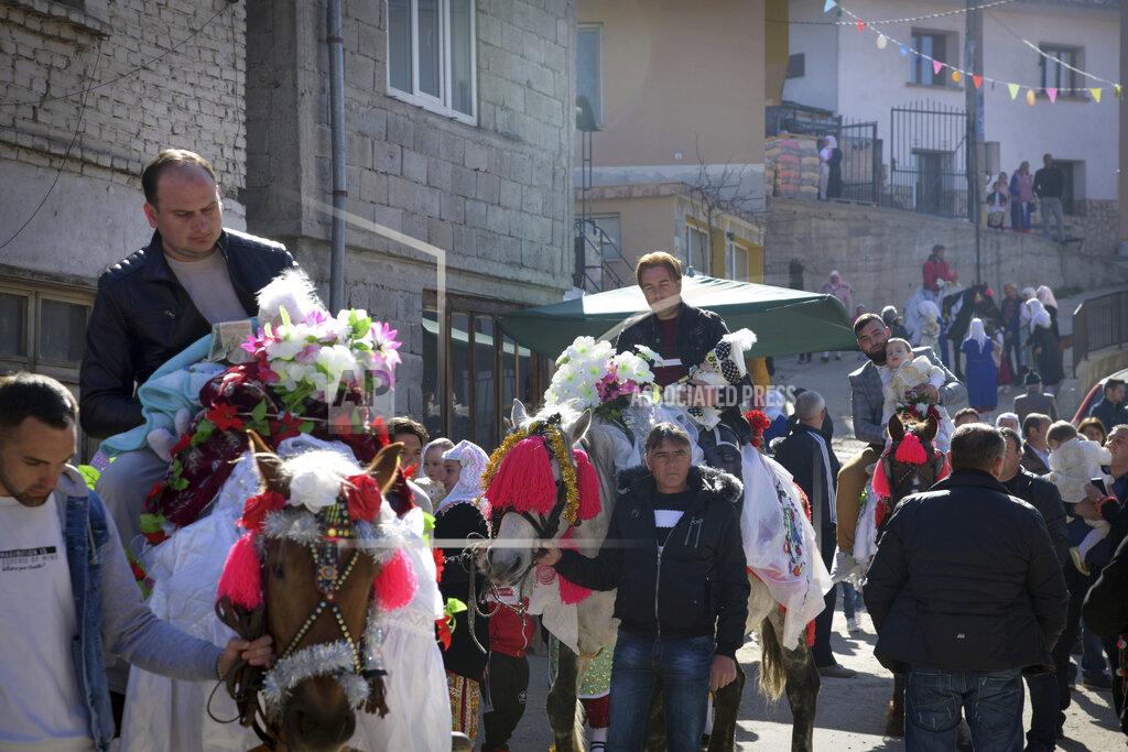 Jordan Simeonov Bulgarian muslims take part in a procession during mass circumcision ceremony in the village of Ribnovo, Bulgaria, Sunday, April 11, 2021. Despite the dangers associated with COVID-19 and government calls to avoid large gatherings, Hundreds of people flocked to the tiny village of Ribnovo in southwestern Bulgaria for a four-day festival of feasting, music and the ritual of circumcision which is considered by Muslims a religious duty and essential part of a man's identity. (AP Photo/Jordan Simeonov)