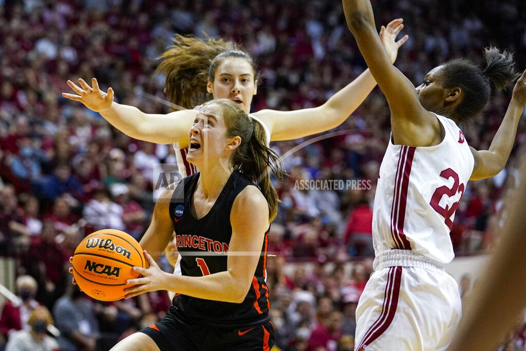 Michael Conroy Princeton guard Abby Meyers (1) shoots in front of Indiana forward Mackenzie Holmes (54) in the first half of a college basketball game in the second round of the NCAA tournament in Bloomington, Ind., Monday, March 21, 2022. (AP Photo/Michael Conroy)