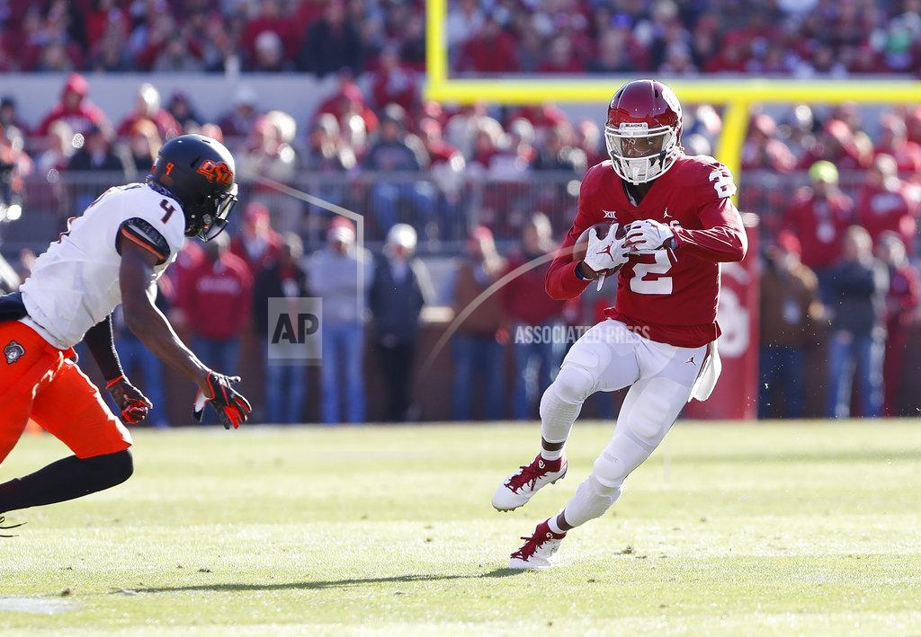Alonzo Adams Oklahoma wide receiver CeeDee Lamb (2) eyes Oklahoma State cornerback A.J. Green (4) during a play in the first quarter of an NCAA college football game in Norman, Okla., Saturday, Nov. 10, 2018. (AP Photo/Alonzo Adams)