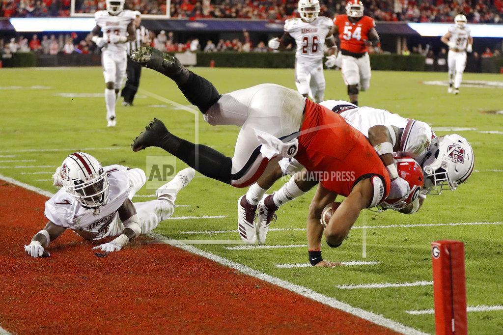John Bazemore Georgia quarterback Justin Fields (1) is stopped short of the end zone by Massachusetts safety Brice McAllister (2) during the second half of an NCAA college football game Saturday, Nov. 17, 2018, in Athens, Ga. (AP Photo/John Bazemore)