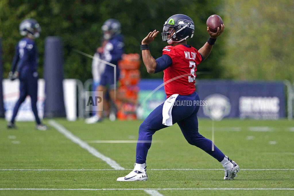 Ted S. Warren Seattle Seahawks quarterback Russell Wilson passes during a practice drill at NFL football training camp, Wednesday, Aug. 12, 2020, in Renton, Wash. (AP Photo/Ted S. Warren, Pool)