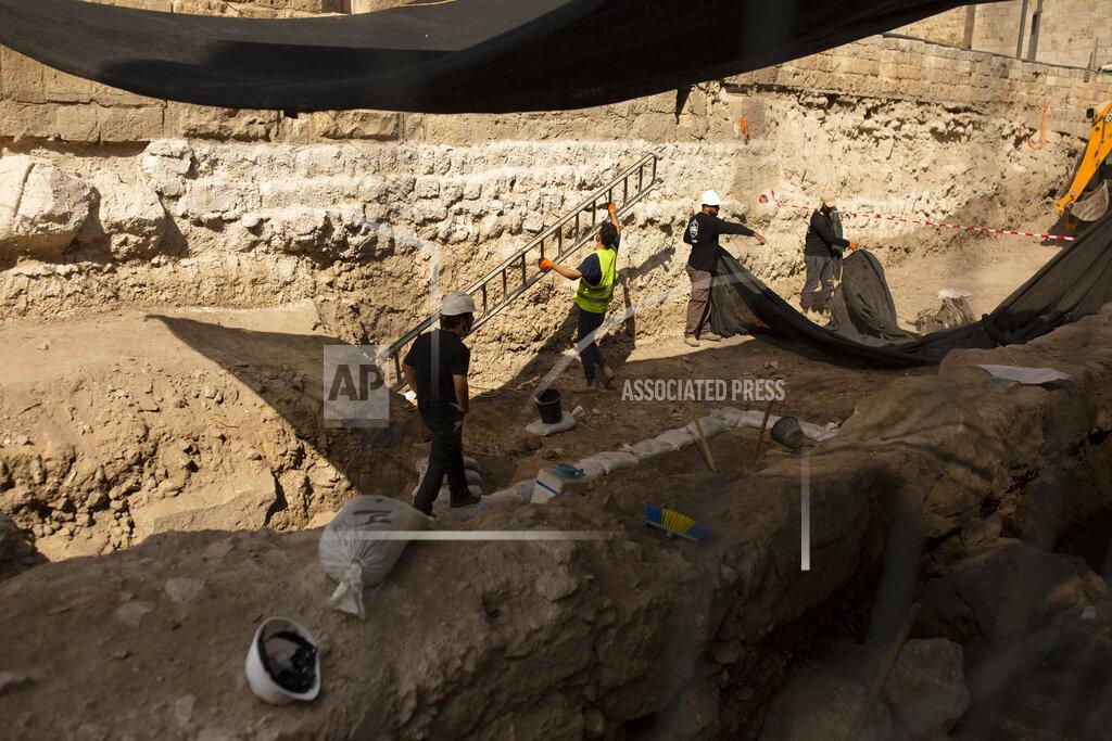 Workers excavate inside the Tower of David Museum in the Old City of Jerusalem, Wednesday, Oct. 28, 2020. Jerusalem's ancient citadel is devoid of tourists due to the pandemic and undergoing a massive restoration and conservation project. (AP Photo/Maya Alleruzzo)