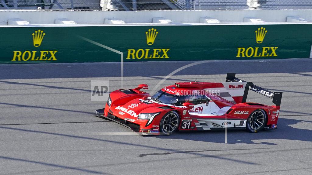 John Raoux Felipe Nasr, far left, of Brazil, leads during the early laps of the Rolex 24 hour auto race at Daytona International Speedway, Saturday, Jan. 30, 2021, in Daytona Beach, Fla. (AP Photo/John Raoux)