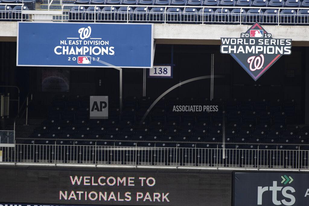 Alex Brandon A "2019 World Series Champions," sign is posted during a baseball training camp workout at Nationals Park, Wednesday, July 8, 2020, in Washington. (AP Photo/Alex Brandon)
