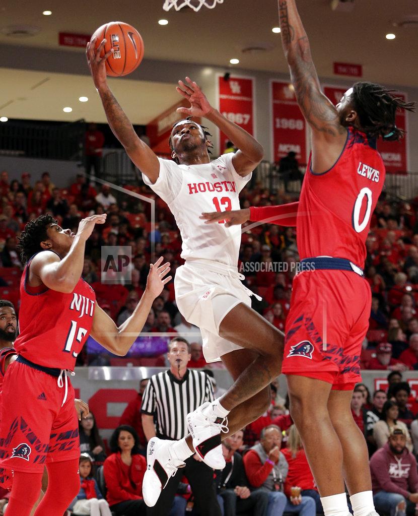 Michael Wyke Houston guard Dejon Jarreau (13) shoots between New Jersey Institute of Technology guard Diandre Wilson (15) and forward Abdul Lewis (0) during the first half of an NCAA college basketball game Saturday, Dec. 29, 2018, in Houston. (AP Photo/Michael Wyke)