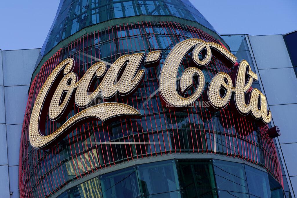 John Locher In this Feb. 4, 2021, photo, a lighted sign adorns the Coca-Cola Store in Las Vegas. The resurgent coronavirus slowed Coca-Cola’s recovery in the fourth quarter, and the company said the slump has continued into this year. (AP Photo/John Locher)