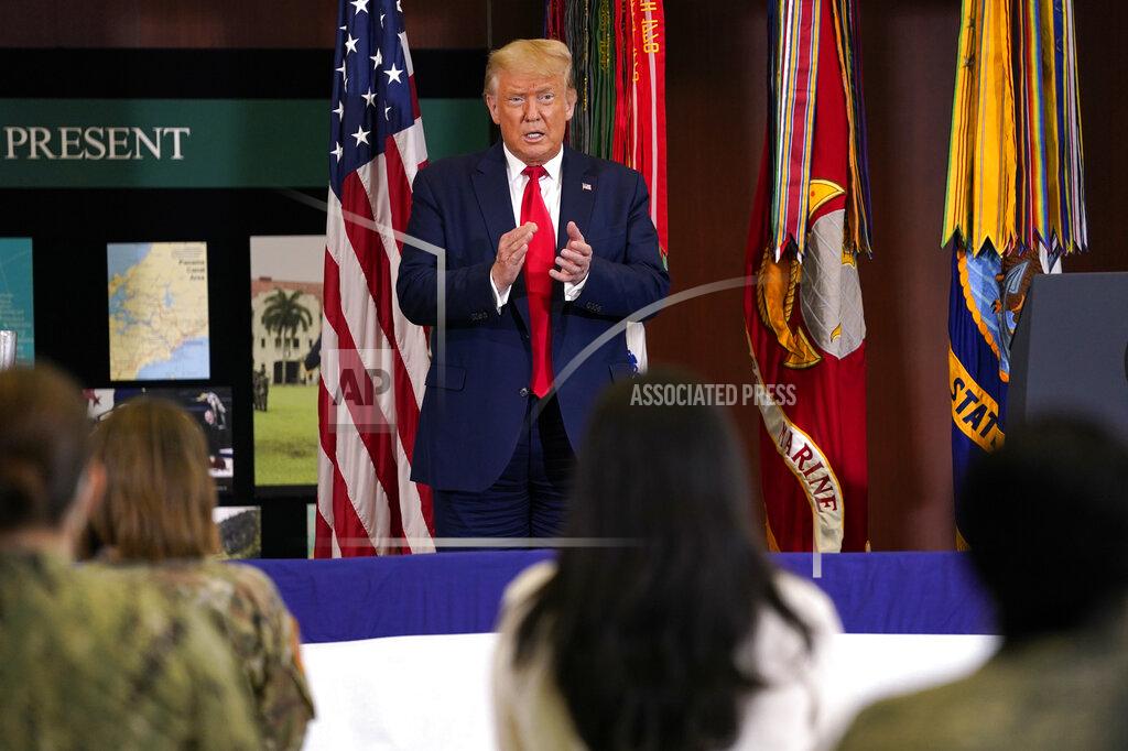 Evan Vucci President Donald Trump claps after delivering a speech about the counternarcotics operations at U.S. Southern Command, Friday, July 10, 2020, in Doral, Fla. (AP Photo/Evan Vucci)