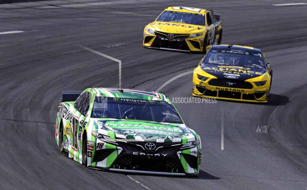 Charles Krupa Kyle Busch (18) pulls ahead of pole sitter Brad Keselowski, right, and Erik Jones (20) during a NASCAR Cup Series auto race at New Hampshire Motor Speedway in Loudon, N.H., Sunday, July 21, 2019. (AP Photo/Charles Krupa)