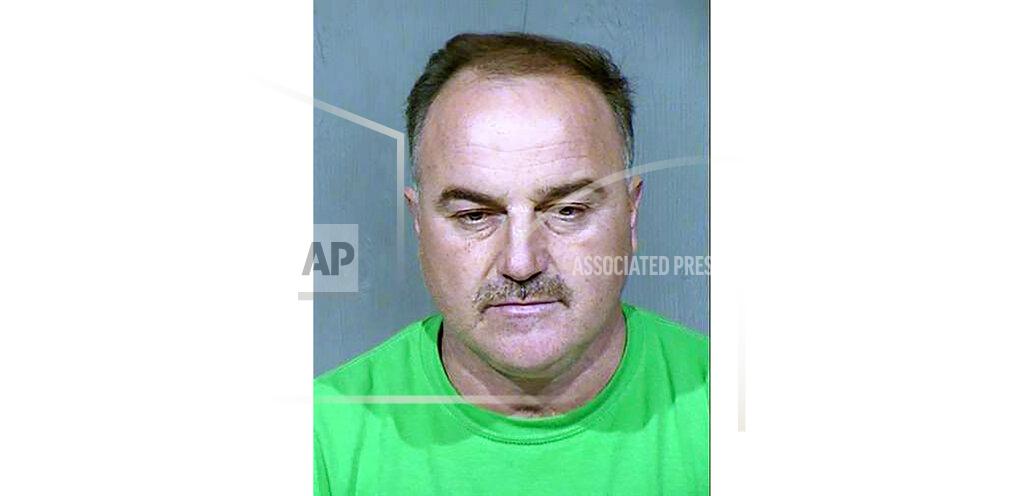 This undated booking photo provided by the Maricopa County Sheriff's Office shows Ali Yousif Ahmed Al-Nouri, an Iraqi man who has been arrested in Arizona as part of an extradition request made by the Iraqi government, which charged him with murder in the 2006 shooting deaths of two police officers in Fallujah. A court hearing for Ahmed is scheduled Tuesday, Feb. 4, 2020, in Phoenix. (Maricopa County Sheriff's Office via AP)
