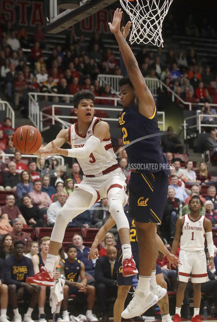 Jeff Chiu Stanford guard Tyrell Terry (3) looks to pass the ball while defended by California forward Andre Kelly during the first half of an NCAA college basketball game in Stanford, Calif., Thursday, Jan. 2, 2020. (AP Photo/Jeff Chiu)