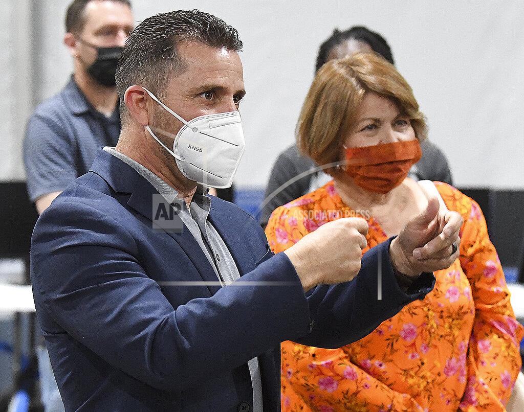 Randy Hoeft Fernie Quiroz, left, with AZ/CA Humanitarian Coalition, asks questions during an open house at the U.S. Border Patrol Yuma Sector processing facility, Tuesday, April 20, 20201, in Yuma, Ariz. Standing next to Quiroz is Emma Torres with Campesinos Sin Fronteras, farmworkers and low income residents in Yuma County. (Randy Hoeft/The Yuma Sun via AP)