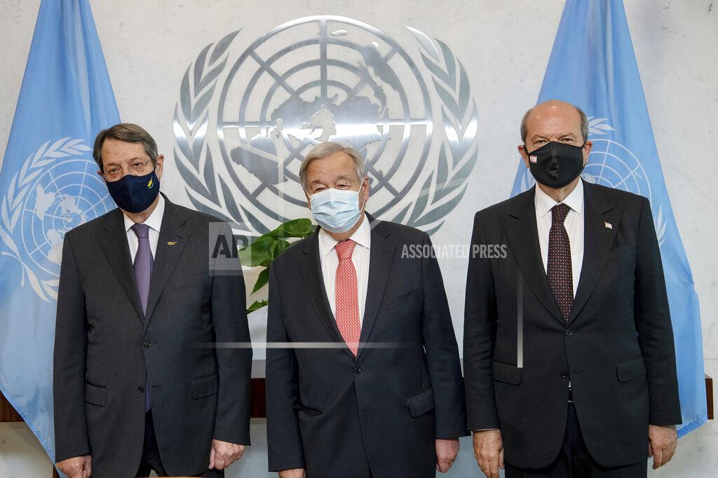Mark Garten In this photo provided by the United Nations, Secretary General Antonio Guterres, center, meets Greek Cypriot Leader Nicos Anastasiades, left, and Turkish Cypriot Leader Ersin Tatar, at U.N. headquarters, Monday, Sept. 27, 2021. (Mark Garten/U.N. via AP)