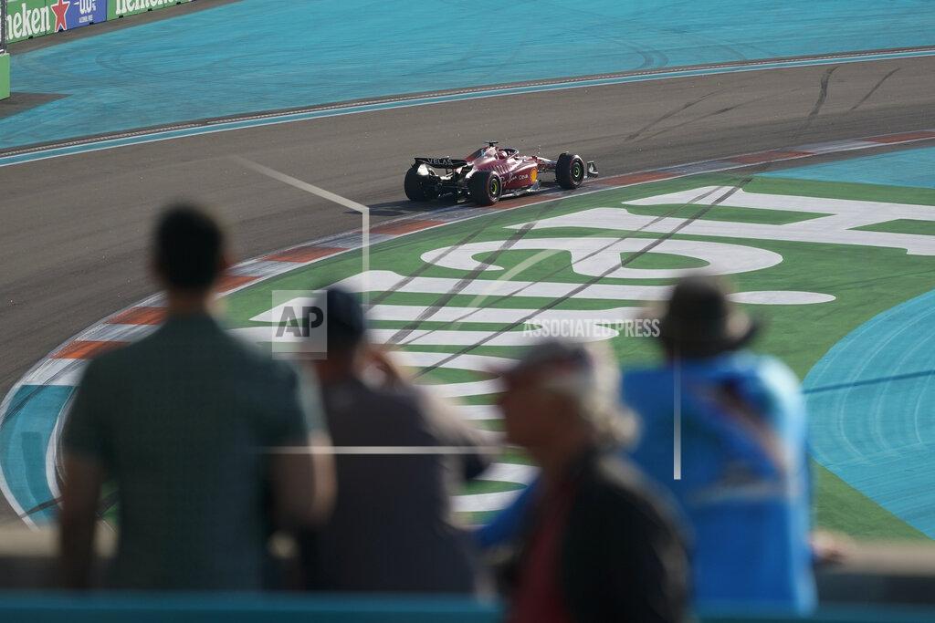 Darron Cummings Spectators watch as Ferrari driver Charles Leclerc of Monaco drives around the circuit during the second practice session for the Formula One Miami Grand Prix auto race at the Miami International Autodrome, Friday, May 6, 2022, in Miami Gardens, Fla. (AP Photo/Darron Cummings)