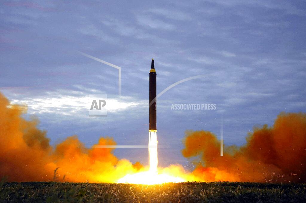 Uncredited FILE - This Aug. 29, 2017, file photo provided by the North Korean government shows what was said to be the test launch of a Hwasong-12 intermediate range missile in Pyongyang, North Korea. Last year was a disaster for North Korean leader Kim Jong Un, who helplessly watched his country's economy decay amid pandemic border closures while brooding over the collapse of made-for-TV summits with former President Donald Trump that failed to lift sanctions from his country. Now he must start over with President Joe Biden, who has previously called him a thug and accused Trump of chasing spectacles instead of meaningful reductions of Kim’s nuclear arsenal. (Korean Central News Agency/Korea News Service via AP, File)