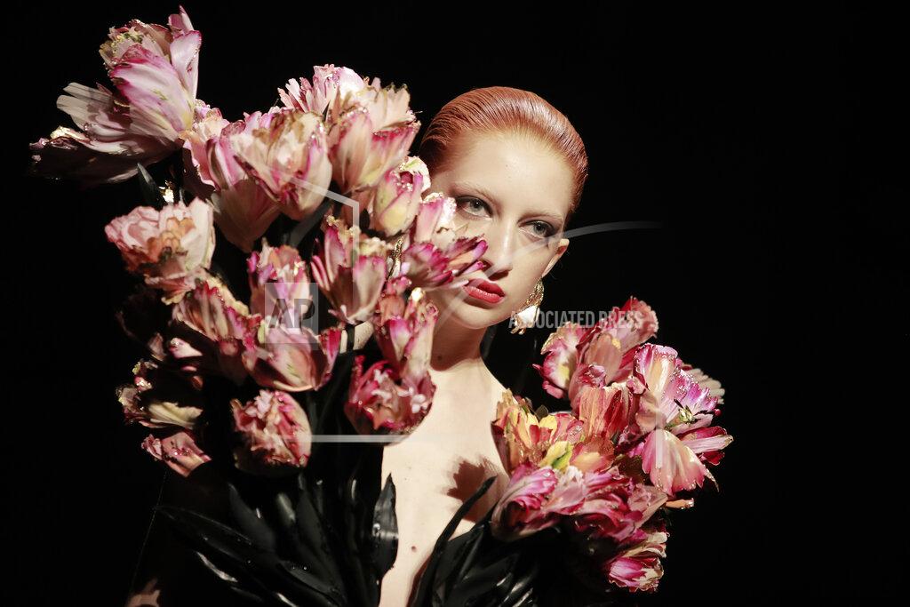 Lewis Joly A model wears a creation for Schiaparelli's Haute Couture Fall/Winter 2022-2023 fashion collection, Monday, July 4, 2022 in Paris. (AP Photo/Lewis Joly)