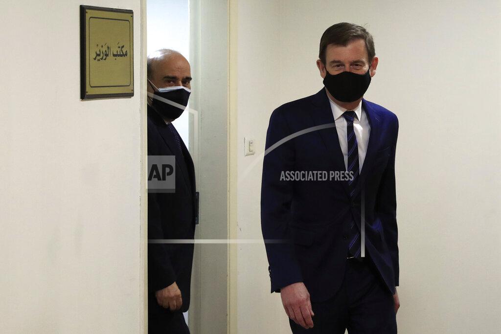 Hussein Malla U.S. Undersecretary of State for Political Affairs David Hale, right, leaves the office of the Lebanese Foreign Minister Charbel Wehbe, left, in Beirut, Lebanon, Wednesday, April 14, 2021. Hale berated Lebanese officials for fighting over the shape of a new government for months while millions of Lebanese endure mounting economic and social hardship. (AP Photo/Hussein Malla)