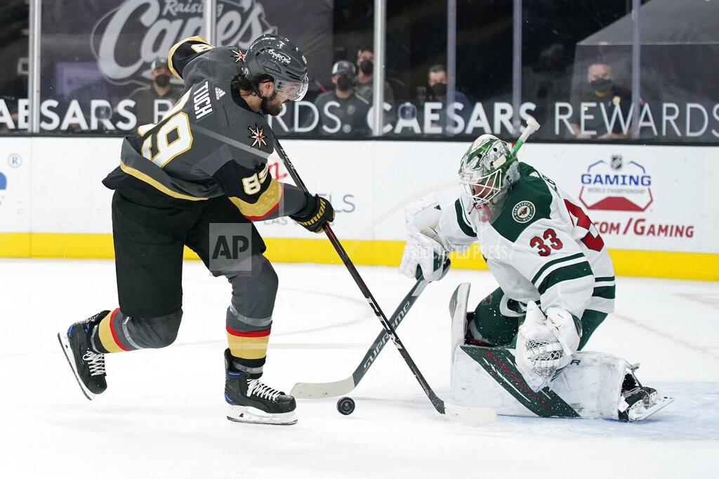 John Locher Minnesota Wild goaltender Cam Talbot (33) blocks a shot by Vegas Golden Knights right wing Alex Tuch (89) during the second period of an NHL hockey game Thursday, April 1, 2021, in Las Vegas. (AP Photo/John Locher)