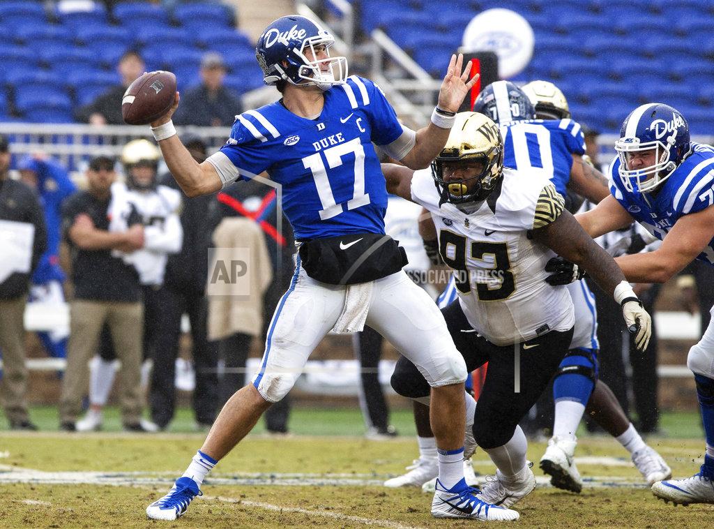Ben Mckeown Duke Quarterback Daniel Jones (17) attempts a pass as Wake Forest's Zeek Rodney (93) pressures during the first half of an NCAA college football game in Durham, N.C., Saturday, Nov. 24, 2018. (AP Photo/Ben McKeown)