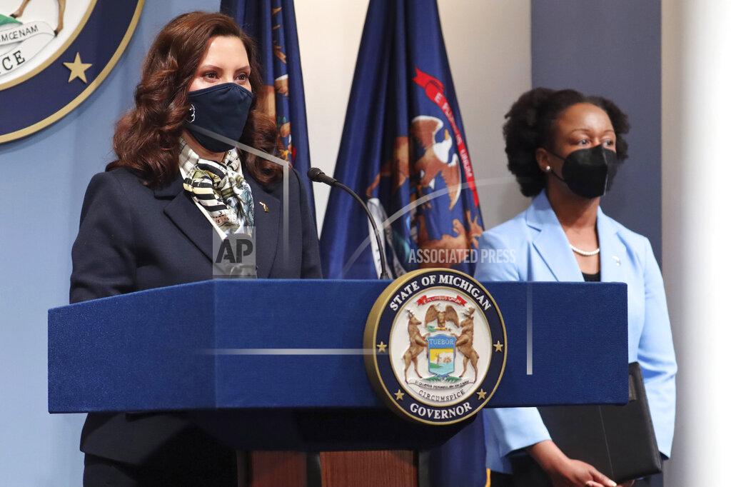 Uncredited In this photo provided by the Michigan Office of the Governor, Gov. Gretchen Whitmer addresses the state during a speech, Wednesday, May 12, 2021, in Lansing, Mich. Michigan health officials are urging primary care physicians to enroll to administer COVID-19 vaccines, as the state prepares to quickly begin vaccinating 12- to 15-year-olds following U.S. authorization. The push to make doses available in physicians' offices will complement the state's focus on taking mobile clinics to places such as churches, and vaccinating people who are homebound. (Michigan Office of the Governor via AP)