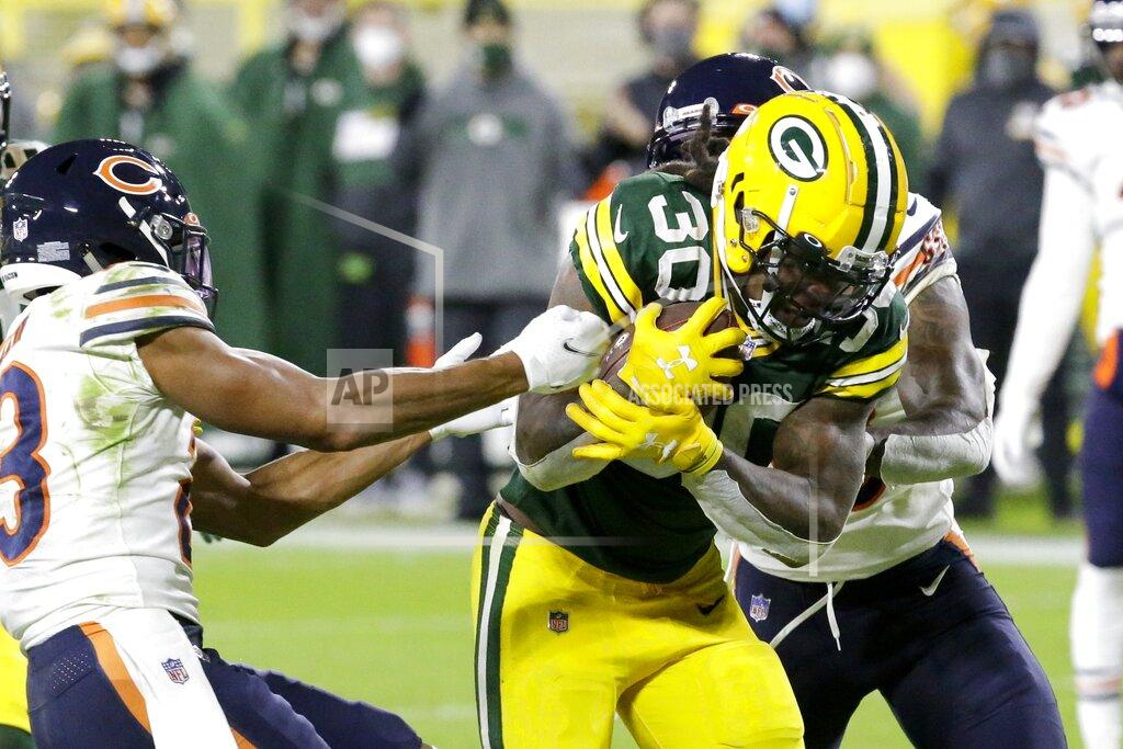 Mike Roemer Green Bay Packers' Jamaal Williams runs for a rtouchdown during the second half of an NFL football game against the Chicago Bears Sunday, Nov. 29, 2020, in Green Bay, Wis. (AP Photo/Mike Roemer)