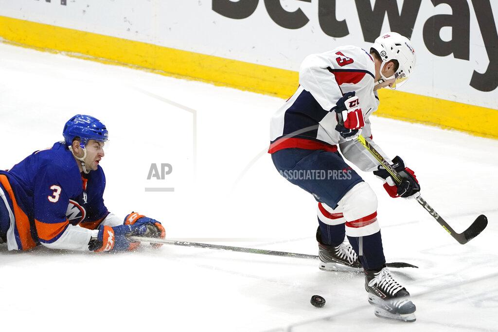 Kathy Willens New York Islanders defenseman Adam Pelech (3) tries to prevent Washington Capitals left wing Conor Sheary (73) from getting to the puck during the second period of an NHL hockey game Thursday, April 22, 2021, in Uniondale, N.Y. (AP Photo/Kathy Willens)