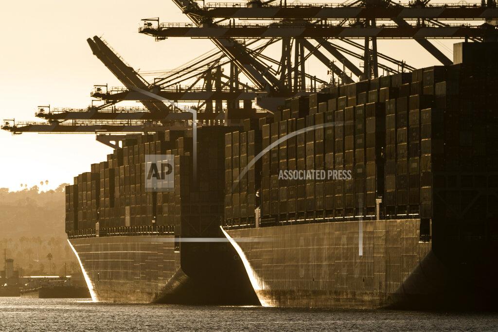 Damian Dovarganes In this Tuesday, Oct. 19, 2021, photo the container ships, CMA CGM T. Rooselvelt (MT), left, and CMA CGM Panama (MT) are moored at Maersk APM Terminals Pacific at the Port of Los Angeles. California Gov, Gavin Newsom on Wednesday, Oct. 20, issued an order that aims to ease bottlenecks at the ports of Los Angeles and Long Beach that have spilled over into neighborhoods where cargo trucks are clogging residential streets. Last week the White House allowed the ports complex to become a 24-hour operation in an effort to break the logjam and reduce shipping delays. (AP Photo/Damian Dovarganes)