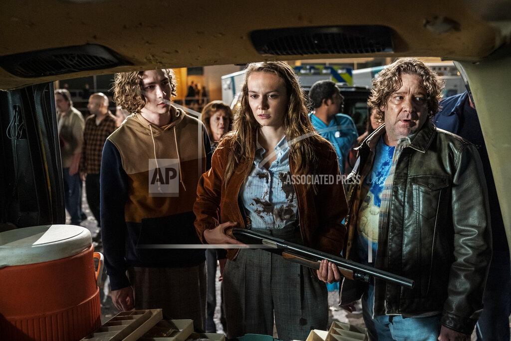 Ryan Green This image released by Universal Pictures shows Dylan Arnold, from left, Andi Matichak and Robert Longstreet in "Halloween Kills," directed by David Gordon Green. (Ryan Green/Universal Pictures via AP)