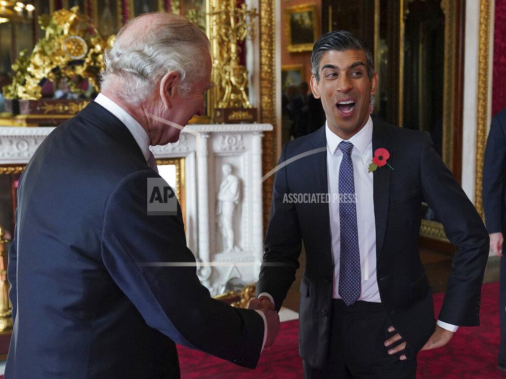 Jonathan Brady FILE - Britain's King Charles III speaks with Prime Minister Rishi Sunak during a reception at Buckingham Palace, London, Nov. 4, 2022, ahead of the COP27 Summit. In his first month as Britain's prime minister, Rishi Sunak has stabilized the economy, reassured allies from Washington to Kyiv and even soothed the European Union after years of sparring between Britain and the bloc. But Sunak’s challenges are just beginning. He is facing a stagnating economy, a cost-of-living crisis – and a Conservative Party that is fractious and increasingly unpopular after 12 years in power. (Jonathan Brady/Pool Photo via AP, File)