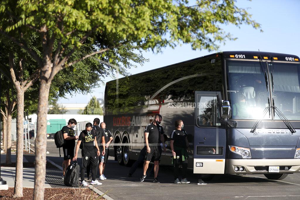 Jed Jacobsohn Members of the Portland Timbers prepare to depart the stadium where the team had been scheduled to play the San Jose Earthquakes in an MLS soccer match in San Jose, Calif., Wednesday, Aug. 26, 2020. Major League Soccer players boycotted five games Wednesday night in a collective statement against racial injustice. The players' actions came after all three NBA playoff games were called off in a protest over the police shooting of Jacob Blake in Wisconsin on Sunday night.