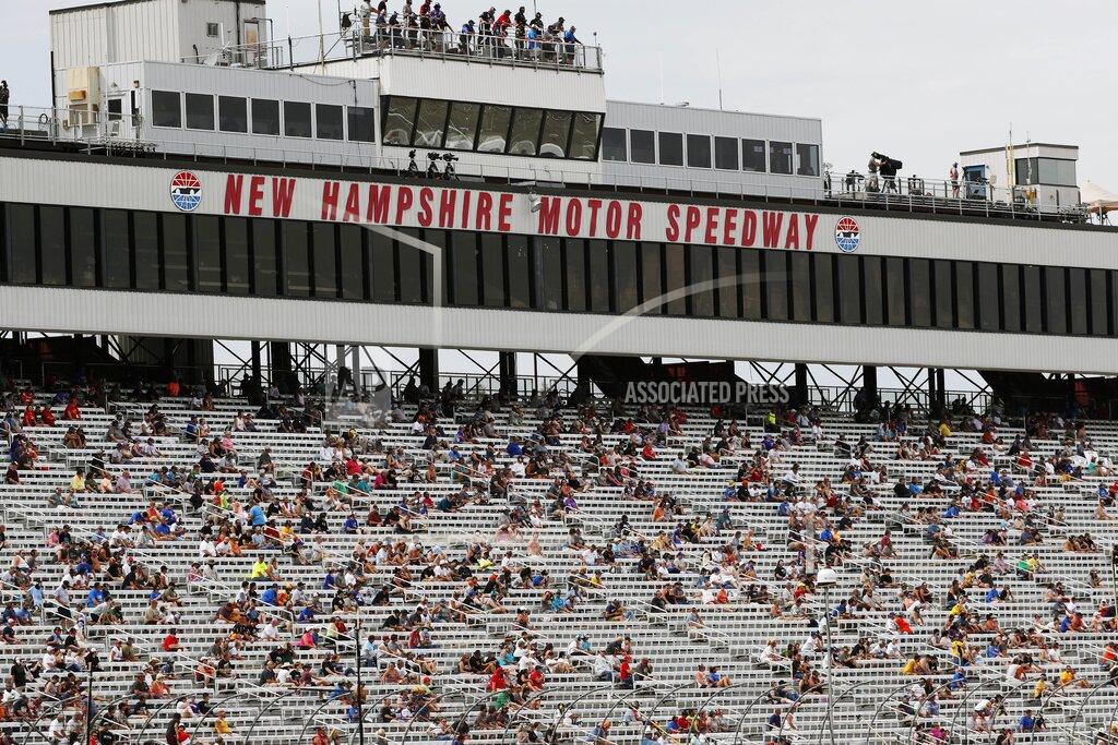 Charles Krupa Fans sit socially distanced, due to the coronavirus pandemic, in the grandstand during a NASCAR Cup Series auto race, Sunday, Aug. 2, 2020, at the New Hampshire Motor Speedway in Loudon, N.H. (AP Photo/Charles Krupa)