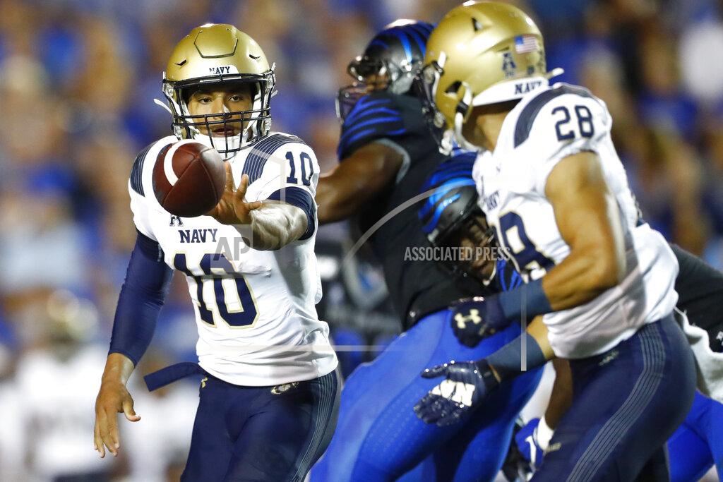 Joe Rondone Navy quarterback Malcolm Perry pitches back to running back Keoni-Kordell Makekau during an NCAA college football game against Memphis in Memphis, Tenn., Thursday, Sept. 26, 2019. (Joe Rondone/The Commercial Appeal via AP)