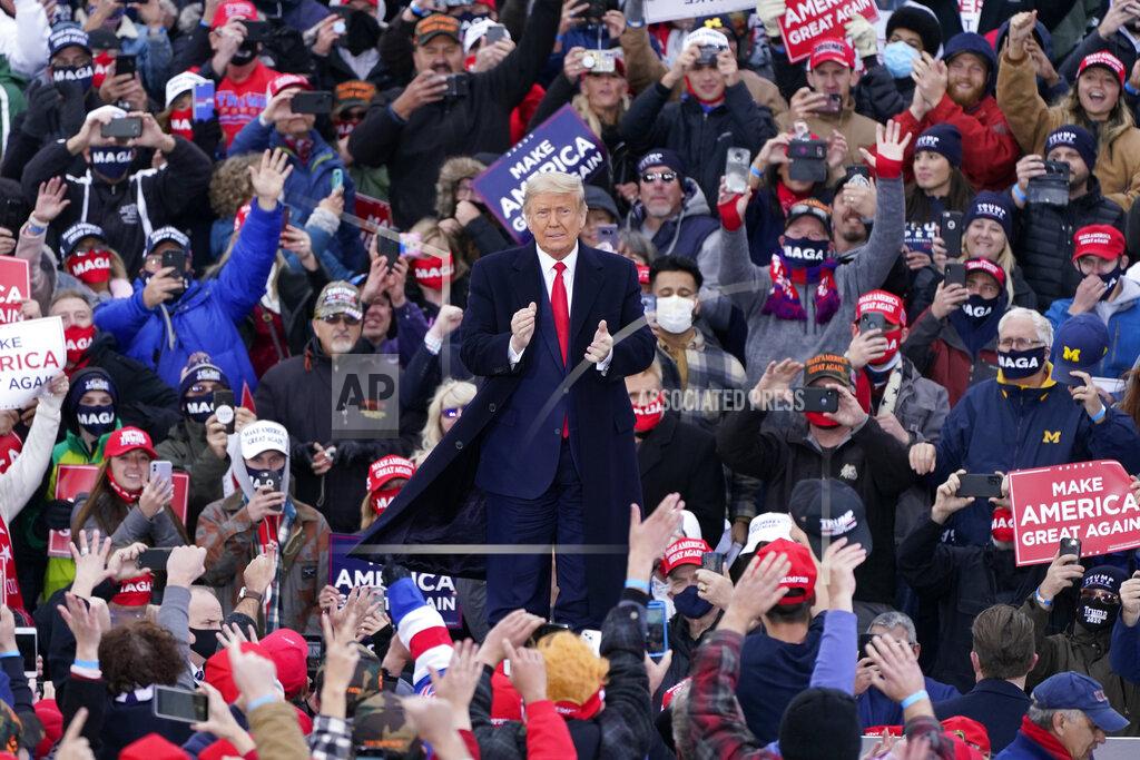 Carlos Osorio President Donald Trump arrives at a campaign rally, Saturday, Oct. 17, 2020, in Norton Shores, Mich. (AP Photo/Carlos Osorio)