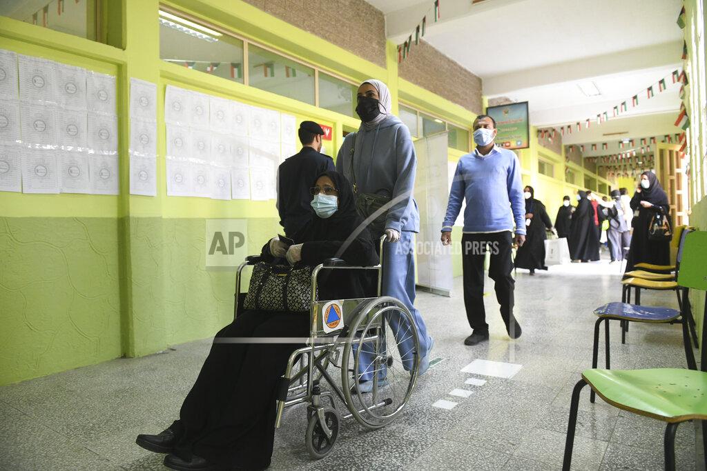 Jaber Abdulkhaleg People arrive to cast their votes for parliamentary elections in the town of Hawally, Kuwait, Saturday, Dec. 5, 2020. (AP Photo/Jaber Abdulkhaleg)
