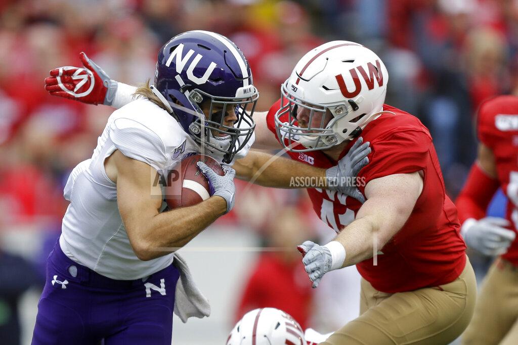 Andy Manis Wisconsin linebacker Noah Burks (41) tackles Northwestern wide receiver Riley Lees (19) during the first half of an NCAA college football game Saturday, Sept. 28, 2019, in Madison, Wis. (AP Photo/Andy Manis)