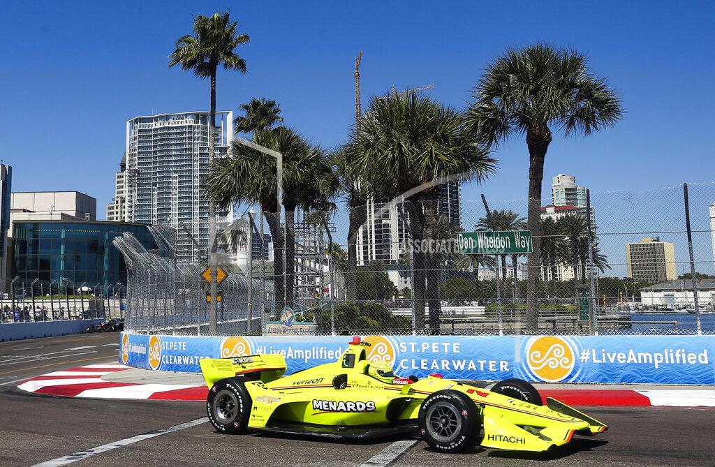 Dirk Shadd FILE - In this March 9, 2018, file photo, the City of St. Petersburg is pictured in the background as IndyCar driver Simon Pagenaud makes his way through turn 10 during the first IndyCar practice for the Firestone Grand Prix of St. Petersburg, Fla. IndyCar plans to crown its champion on the streets of St. Petersburg, Florida, as the original opener has been rescheduled to Oct. 25 as the finale. (Dirk Shadd/The Tampa Bay Times via AP, File)
