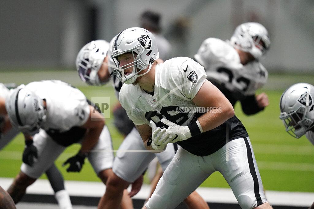 John Locher Las Vegas Raiders defensive end Maxx Crosby stretches during an NFL football training camp practice Monday, Aug. 17, 2020, in Henderson. (AP Photo/John Locher, Pool)