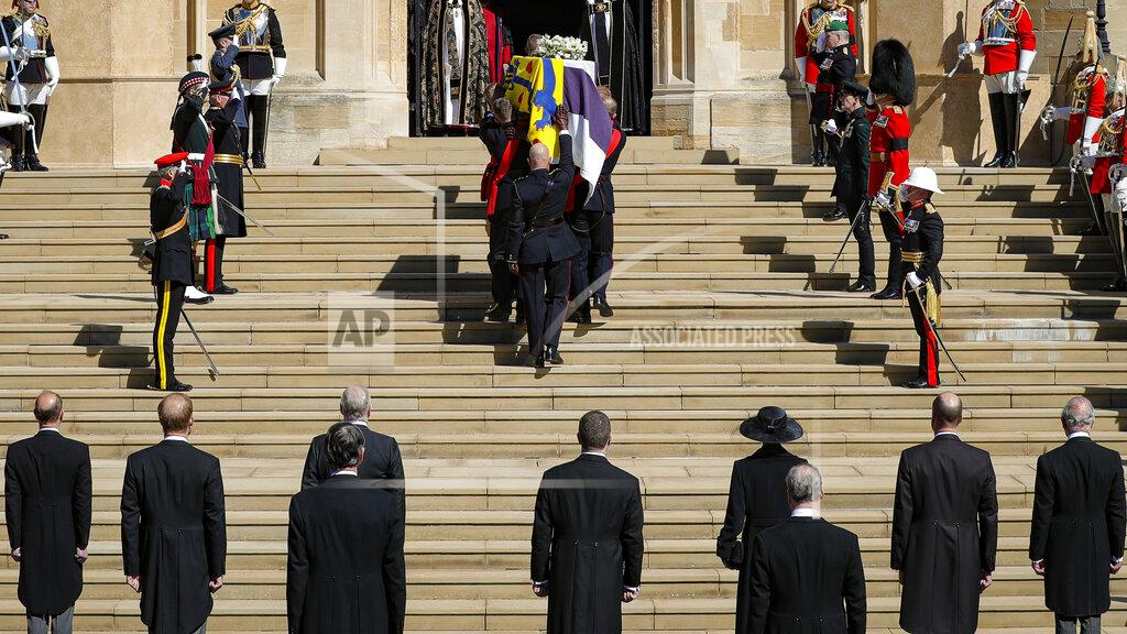 Kirsty Wigglesworth Members of the Royal Family watch as thhe coffin is carried inside the St George's Chapel for the funeral of Britain's Prince Philip inside Windsor Castle in Windsor, England, Saturday, April 17, 2021. (Kirsty Wigglesworth/Pool via AP)