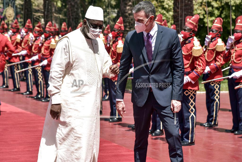 Seyllou Spanish Prime Minister Pedro Sanchez, right, is received by Senegalese President Macky Sall at the Palace of the Republic in Dakar, Senegal, Friday, April 9 2021 after his meeting with Senegalese President Macky Sall. Sanchez is on a mini-tour to two African nations that are key in the European country's new push to bolster ties with the neighboring continent and mitigate the migration flows that many fear could increase as a consequence of the coronavirus pandemic.(Seyllou/Pool Photo via AP)